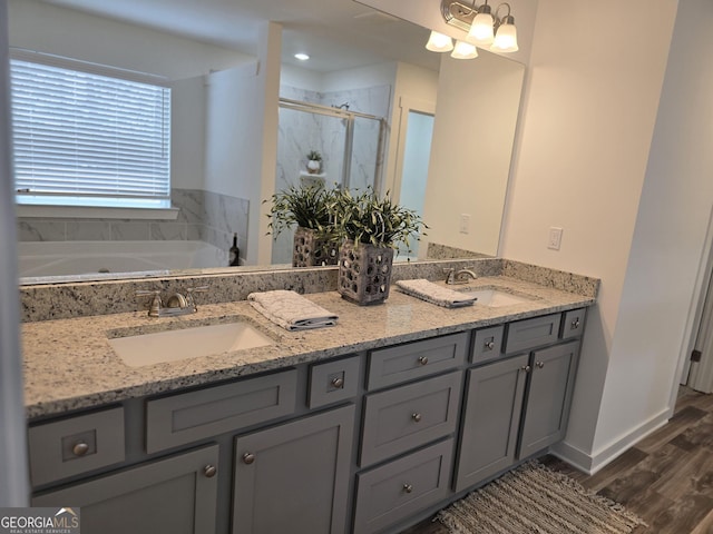 bathroom with vanity, separate shower and tub, and hardwood / wood-style floors