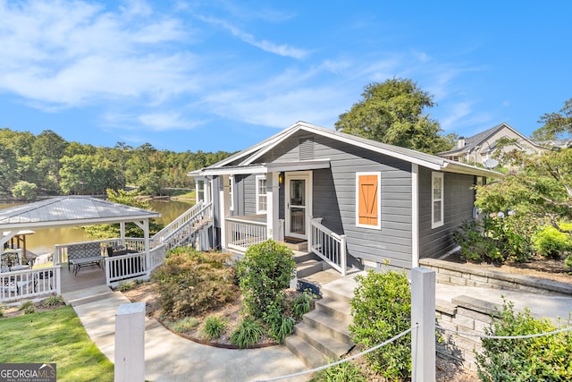 view of front of home featuring a water view and a porch