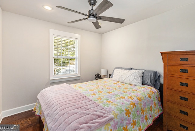 bedroom featuring ceiling fan and dark hardwood / wood-style flooring