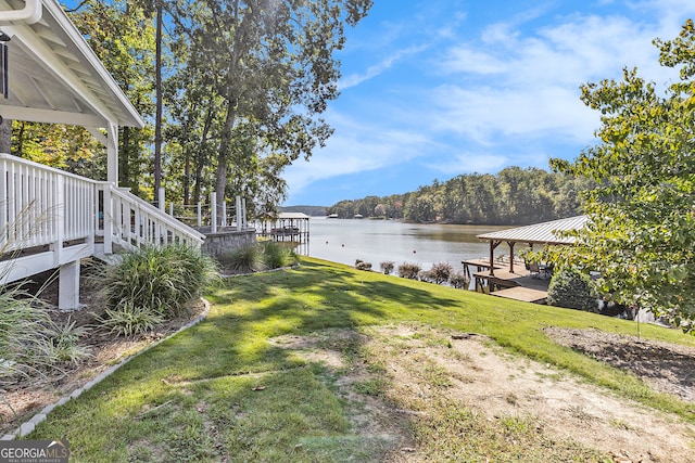 view of yard with a gazebo and a water view