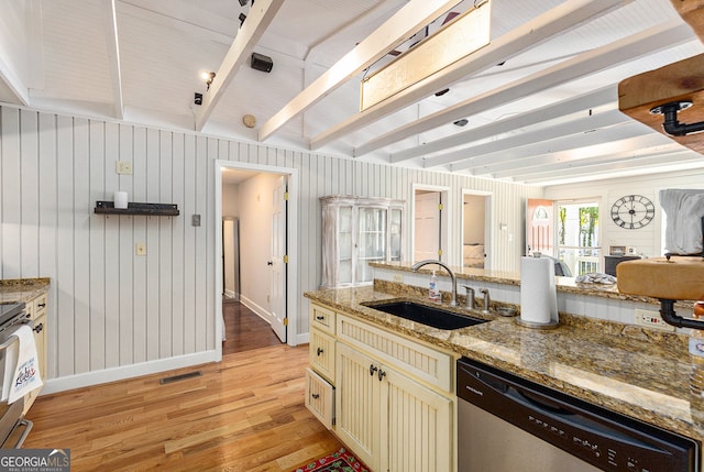 kitchen featuring light hardwood / wood-style floors, sink, beam ceiling, stainless steel appliances, and light stone countertops