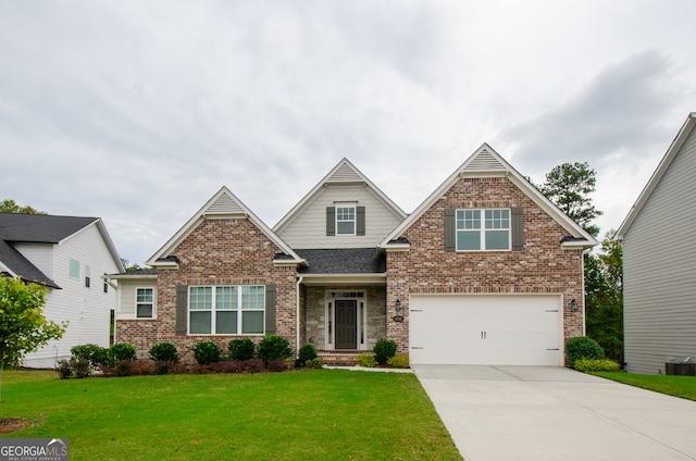 craftsman-style home with a front yard and a garage