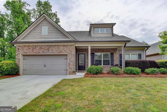 view of front of property with a front lawn and a garage