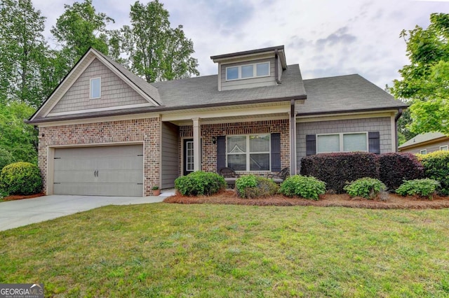 view of front of home featuring covered porch, a front yard, and a garage