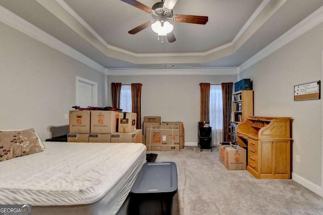 bedroom featuring ceiling fan, light carpet, and multiple windows