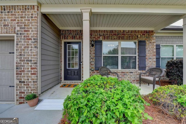 doorway to property featuring a garage