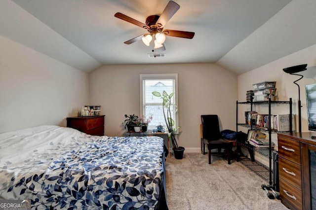 bedroom featuring light carpet, lofted ceiling, and ceiling fan