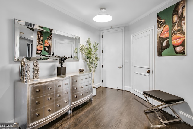 interior space with ornamental molding and dark hardwood / wood-style floors