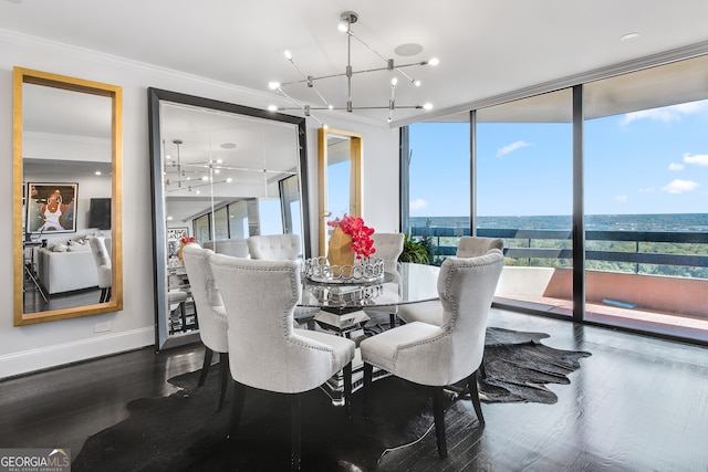 dining room with crown molding, hardwood / wood-style flooring, a wall of windows, and a notable chandelier