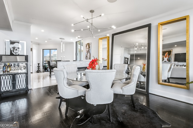 dining space with crown molding, dark hardwood / wood-style floors, and an inviting chandelier