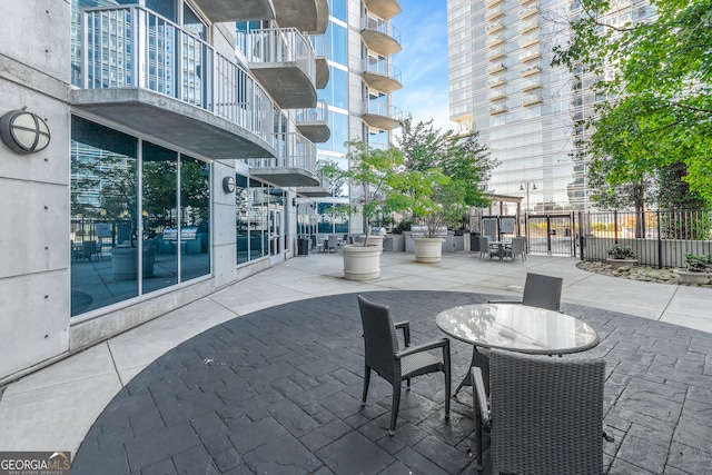 view of patio featuring a balcony