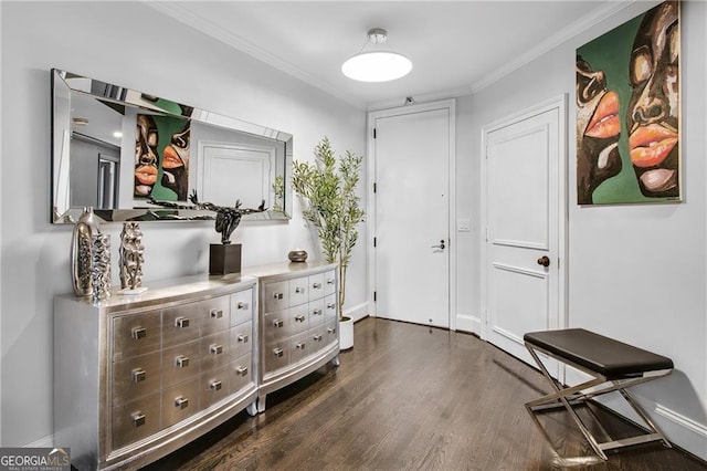 interior space with ornamental molding and dark hardwood / wood-style floors