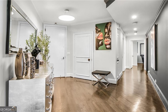 hall featuring crown molding and dark hardwood / wood-style flooring