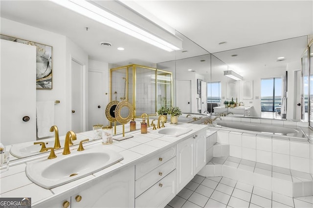 bathroom with vanity, tile patterned floors, and independent shower and bath