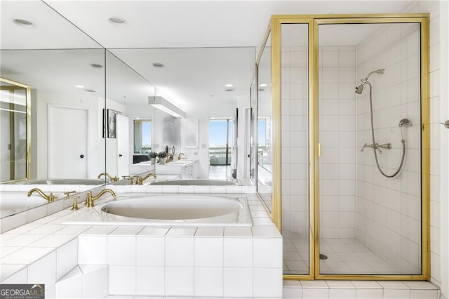 bathroom featuring separate shower and tub