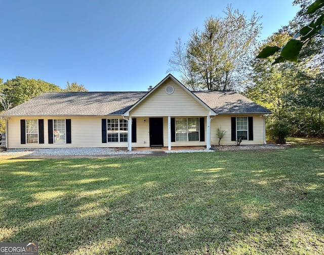 ranch-style home featuring a front yard