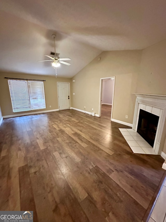 unfurnished living room featuring light wood-type flooring, lofted ceiling, ceiling fan, and a tile fireplace