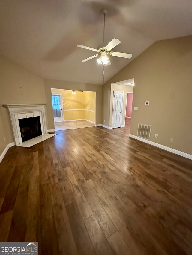 unfurnished living room with hardwood / wood-style flooring, ceiling fan, and vaulted ceiling