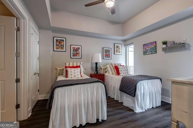 bedroom with dark wood-type flooring and ceiling fan