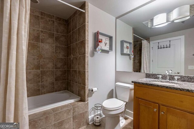 full bathroom featuring shower / tub combo with curtain, vanity, and toilet