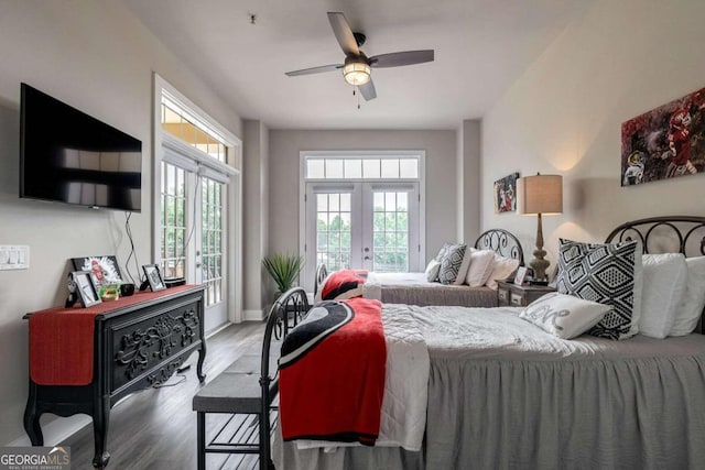 bedroom with wood-type flooring, ceiling fan, and french doors