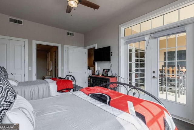 bedroom with ceiling fan, access to exterior, hardwood / wood-style floors, and multiple windows