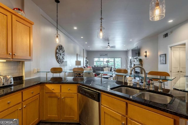 kitchen with dishwasher, ceiling fan, sink, and decorative light fixtures