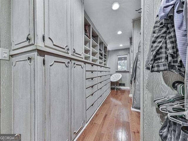 spacious closet featuring hardwood / wood-style floors