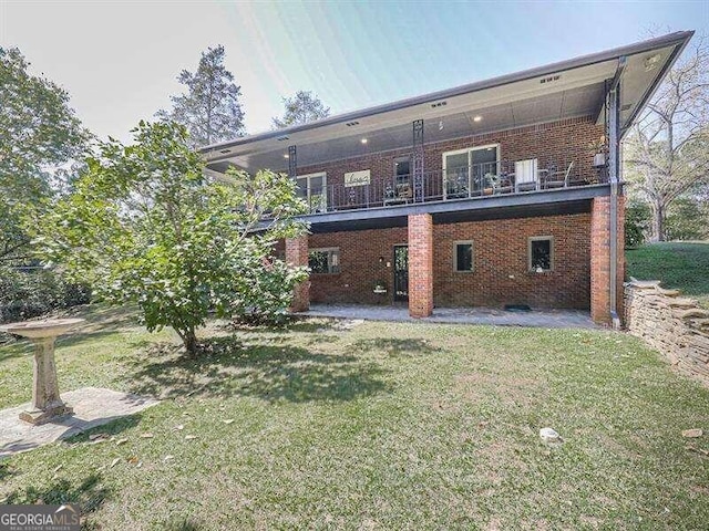 back of property featuring a patio and a yard