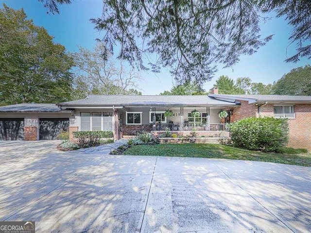 ranch-style house featuring a garage