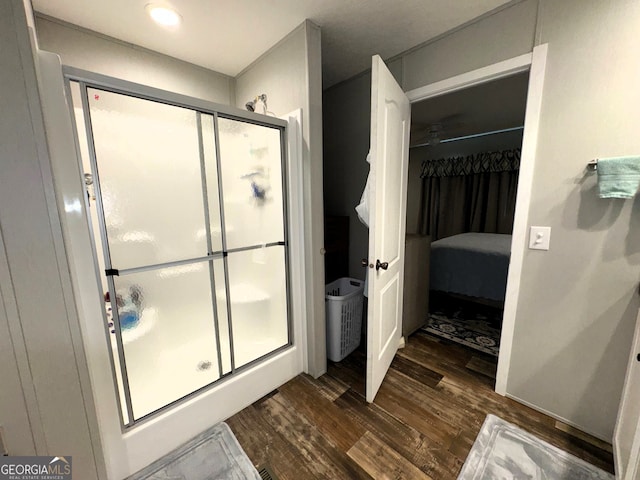 bathroom featuring walk in shower and hardwood / wood-style floors