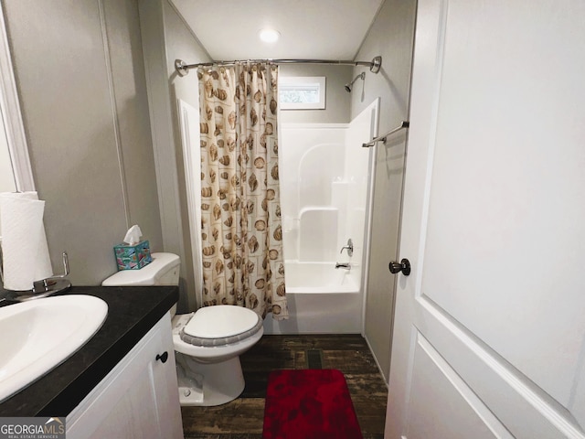 full bathroom featuring shower / tub combo with curtain, vanity, toilet, and hardwood / wood-style flooring