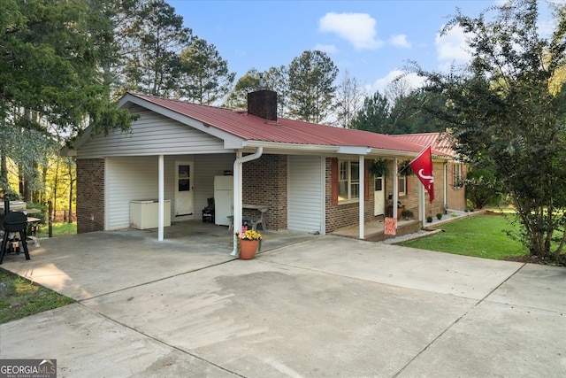 ranch-style house featuring a carport