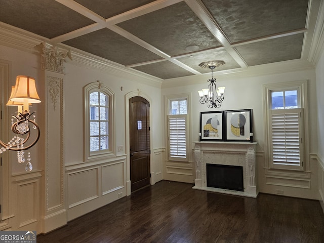 dining area with baseboards, an inviting chandelier, dark wood finished floors, and crown molding