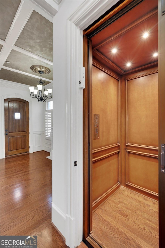 living area featuring a ceiling fan, crown molding, dark wood-style floors, and a fireplace