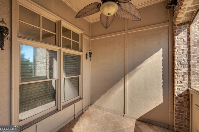 view of exterior entry with ceiling fan