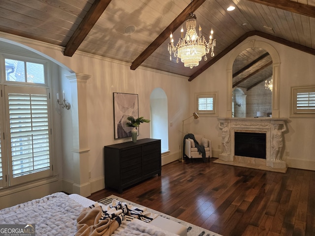 bedroom featuring arched walkways, visible vents, multiple windows, and vaulted ceiling with beams