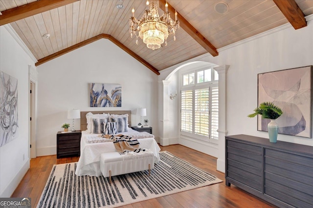 living room featuring lofted ceiling with beams, visible vents, arched walkways, and wood-type flooring