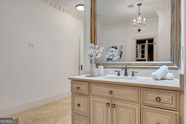 bathroom featuring vanity, crown molding, a chandelier, and tile patterned flooring