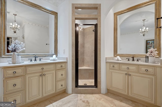 bathroom featuring walk in shower, vanity, and a chandelier