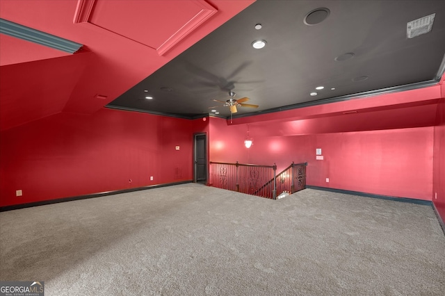 interior space with ceiling fan and crown molding