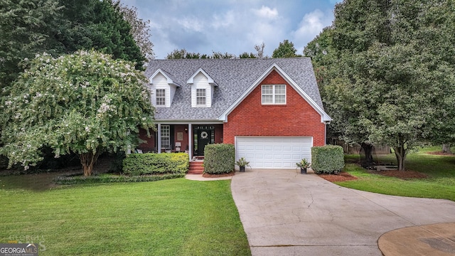 view of front of home featuring a front yard and a garage