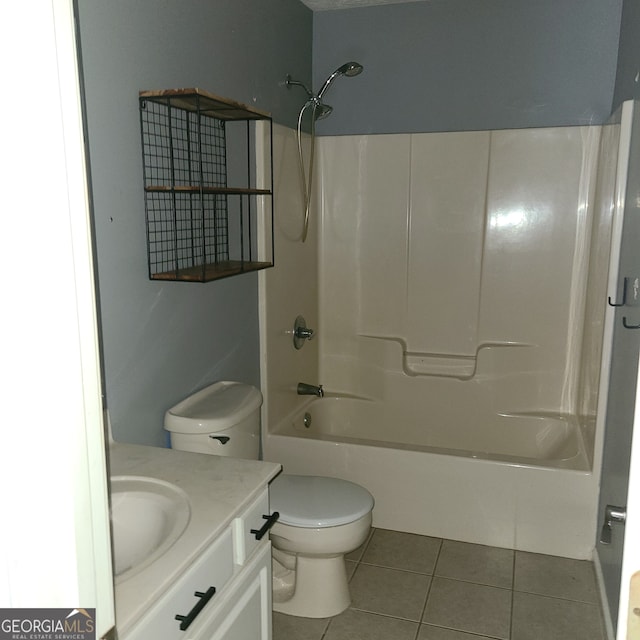 full bathroom with tile patterned floors, shower / washtub combination, vanity, and toilet