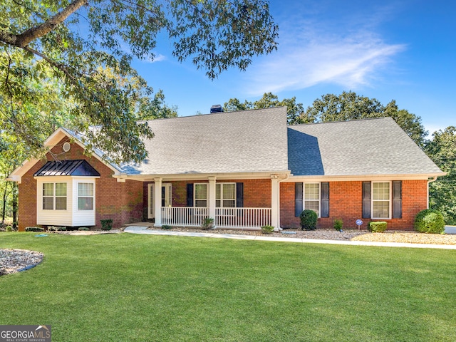 view of front of home featuring a front lawn and covered porch