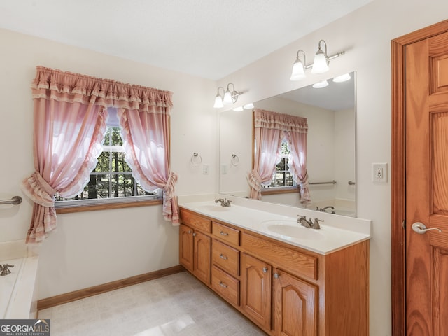 bathroom featuring a tub to relax in and vanity