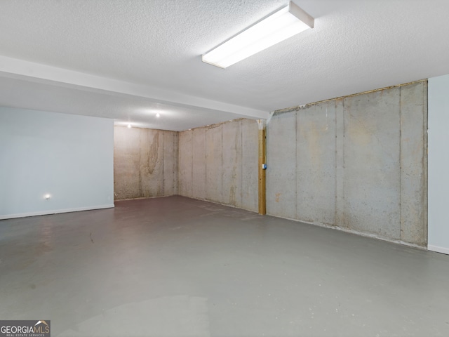 basement with a textured ceiling