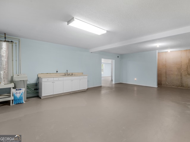 interior space with sink and a textured ceiling