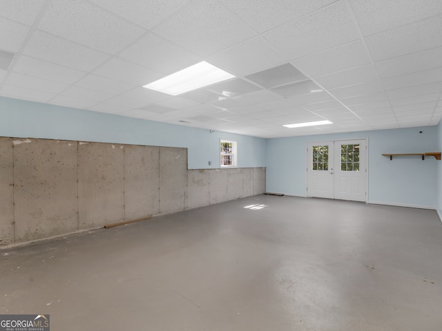 basement featuring a paneled ceiling