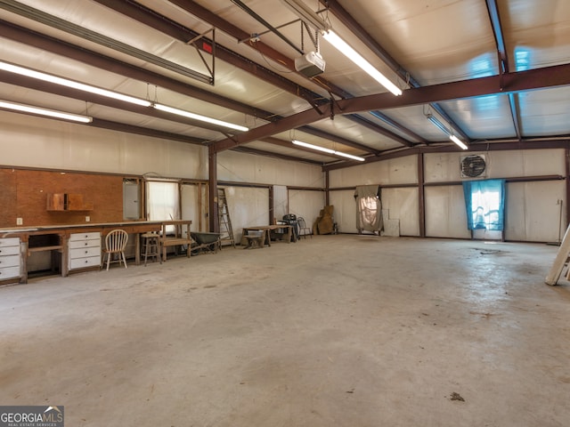 garage featuring electric panel and a garage door opener