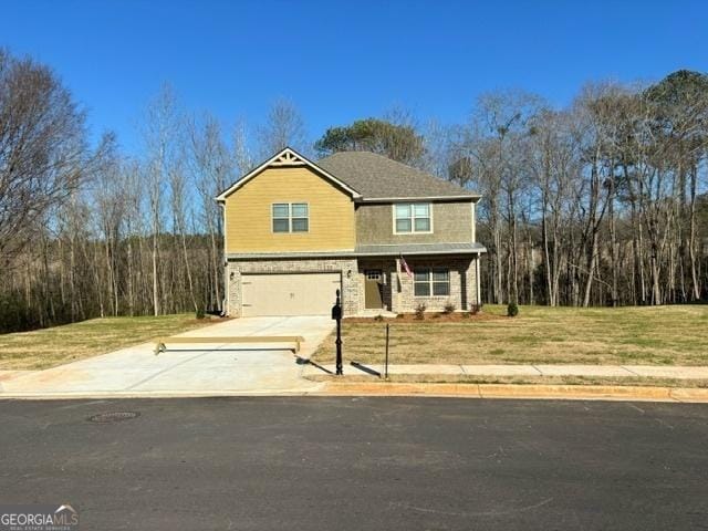 view of front facade featuring a front yard and a garage